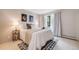 Bright bedroom featuring a comfortable bed, stylish decor, and a window with natural light at 7770 W 38Th Ave # 207, Wheat Ridge, CO 80033