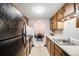 Efficient kitchen with ample cabinet space and essential appliances at 7770 W 38Th Ave # 207, Wheat Ridge, CO 80033