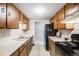 Efficient kitchen with ample cabinet space and essential appliances at 7770 W 38Th Ave # 207, Wheat Ridge, CO 80033