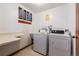 On-site laundry room with a washer, dryer, utility sink and counter space for added convenience at 7770 W 38Th Ave # 207, Wheat Ridge, CO 80033