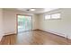 Bedroom with hardwood floors, window and large sliding glass doors to the backyard at 3375 Zephyr Ct, Wheat Ridge, CO 80033