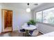 Cozy breakfast nook with natural light, a modern pendant light, and view to the outside at 3375 Zephyr Ct, Wheat Ridge, CO 80033