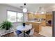 Eat-in dining area offers a sun-filled view of the backyard greenery and charming modern accents at 3375 Zephyr Ct, Wheat Ridge, CO 80033