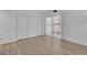 Cozy bedroom with wood-look floors, a closet, and a window with natural light at 14467 E 1St Dr # A04, Aurora, CO 80011