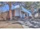 Charming exterior view highlighting the building's architecture, brick accents, and well-maintained landscaping at 14467 E 1St Dr # A04, Aurora, CO 80011