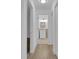 Hallway features bathroom access and wood-look flooring at 14467 E 1St Dr # A04, Aurora, CO 80011