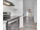 Bright kitchen open to the living area with modern appliances and sliding glass door at 14467 E 1St Dr # A04, Aurora, CO 80011