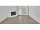 Inviting living room featuring laminate flooring, fireplace and sliding glass door at 14467 E 1St Dr # A04, Aurora, CO 80011