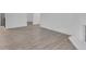 Spacious living room featuring wood-look floors, fireplace, and an open layout at 14467 E 1St Dr # A04, Aurora, CO 80011