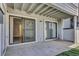 Covered patio with sliding glass doors offers indoor-outdoor living at 14467 E 1St Dr # A04, Aurora, CO 80011
