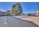 Community pool, currently closed, surrounded by grass, trees and apartment buildings at 14467 E 1St Dr # A04, Aurora, CO 80011
