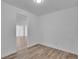 Spacious, bright room with wood-style flooring and a glimpse of an adjacent space at 14467 E 1St Dr # A04, Aurora, CO 80011