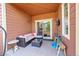 Inviting back porch with cozy seating, sliding door access, and space for relaxation and outdoor entertainment at 675 W 171St Pl, Broomfield, CO 80023