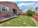 Spacious backyard with patio, swing chairs, grill, and lush lawn, perfect for outdoor gatherings and relaxation at 675 W 171St Pl, Broomfield, CO 80023