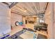 Unfinished basement space with a gym, sofa, and open layout, perfect for a versatile recreation and fitness area at 675 W 171St Pl, Broomfield, CO 80023