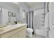 A clean bathroom featuring a combined tub and shower, towel rack, and vanity with a sink at 675 W 171St Pl, Broomfield, CO 80023