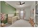 A bedroom includes a ceiling fan, soft carpet, modern crib, and ample space at 675 W 171St Pl, Broomfield, CO 80023