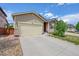 Inviting single-Gathering home showcasing a well-maintained lawn and a two-car garage at 675 W 171St Pl, Broomfield, CO 80023