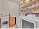 The laundry room features a utility sink, work area, and washer and dryer hookups at 675 W 171St Pl, Broomfield, CO 80023