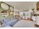 Open-concept living space featuring a modern kitchen, cozy seating, and stylish decor at 675 W 171St Pl, Broomfield, CO 80023