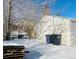 Backyard with detached garage and snow at 1274 Hudson St, Denver, CO 80220