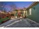 Cozy backyard with a patterned concrete patio, stone accents and string lights, ideal for evening entertainment at 4577 Elm Ct, Denver, CO 80211