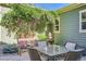 Serene outdoor seating area with lush greenery and a tranquil water fountain feature, perfect for relaxation at 4577 Elm Ct, Denver, CO 80211