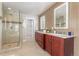 Beautiful bathroom featuring a glass shower, double vanity, and modern fixtures at 4577 Elm Ct, Denver, CO 80211