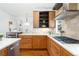 Gourmet kitchen features stone countertops, stainless appliances, and custom cabinetry at 4577 Elm Ct, Denver, CO 80211