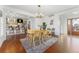 Open floor plan showcasing the dining area with an island kitchen and lots of natural light at 4577 Elm Ct, Denver, CO 80211