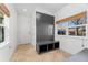 Bright mudroom with custom built-in storage, natural light, and neutral tile flooring at 4577 Elm Ct, Denver, CO 80211