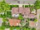 Aerial shot displays a well-maintained home with a large deck, lush greenery, and a landscaped yard at 503 15Th St, Golden, CO 80401
