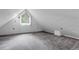 Attic featuring wall-to-wall carpeting and a window at 503 15Th St, Golden, CO 80401