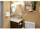 Cozy bathroom features a corner sink, decorative wall art and updated fixtures at 503 15Th St, Golden, CO 80401