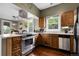 Well-lit kitchen featuring stainless steel appliances and plentiful counter space at 503 15Th St, Golden, CO 80401