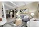 Open-concept living area with stylish furnishings, neutral tones, and views of the kitchen at 503 15Th St, Golden, CO 80401