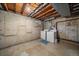 Unfinished basement with laundry hookups and washer/dryer at 8308 W 90Th Ave, Westminster, CO 80021