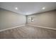 Well-lit bedroom with grey walls, carpet, and ample closet space at 8308 W 90Th Ave, Westminster, CO 80021