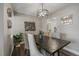 Charming dining area with a rustic-style table and modern lighting at 8308 W 90Th Ave, Westminster, CO 80021