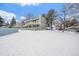 Townhome exterior with snow covered yard at 8308 W 90Th Ave, Westminster, CO 80021