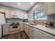 Renovated kitchen featuring new countertops, cabinets, and appliances at 8308 W 90Th Ave, Westminster, CO 80021