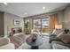 Bright living room with fireplace and sliding glass doors leading to a patio at 8308 W 90Th Ave, Westminster, CO 80021