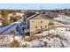 Aerial view of townhome showcasing rear deck and snowy surroundings at 5445 Canyon View Dr, Castle Rock, CO 80104