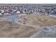 Aerial view showcases a neighborhood park with playground and walking paths at 12988 E 108Th Pl, Commerce City, CO 80022