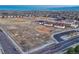 Wide aerial view of a school, playground, and community in a suburban neighborhood at 12988 E 108Th Pl, Commerce City, CO 80022