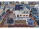 Aerial view of a home with solar panels, a fenced yard with a trampoline, and a patio area at 12988 E 108Th Pl, Commerce City, CO 80022