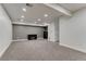 Finished basement with neutral carpet, a modern fireplace, and recessed lighting at 12988 E 108Th Pl, Commerce City, CO 80022