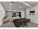 Basement entertaining area with foosball table, couch, and flat screen TV at 12988 E 108Th Pl, Commerce City, CO 80022