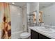 Bright bathroom with a sunflower-themed shower curtain and coordinating towel at 12988 E 108Th Pl, Commerce City, CO 80022