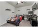 Well-lit bedroom with black shelves and sleek black desk, ideal for studying or working at 12988 E 108Th Pl, Commerce City, CO 80022